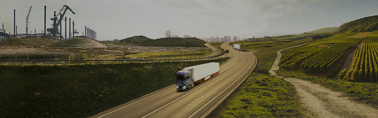Truck driving down highway showing multiple landscapes