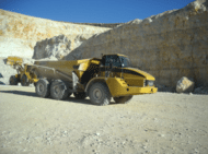 Yellow articulated dump truck in action