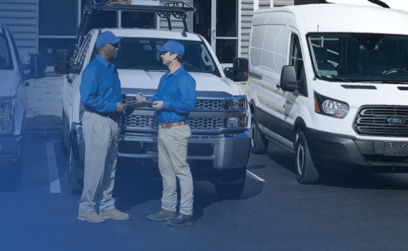 Professional services greeting in front of truck