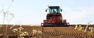 Medium Horsepower tractor preparing soil