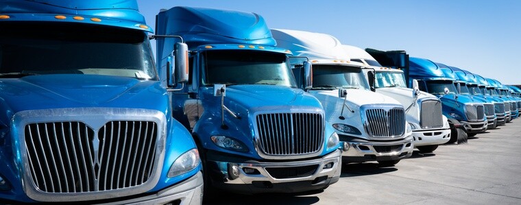 US semi truck cabs lined up in a row