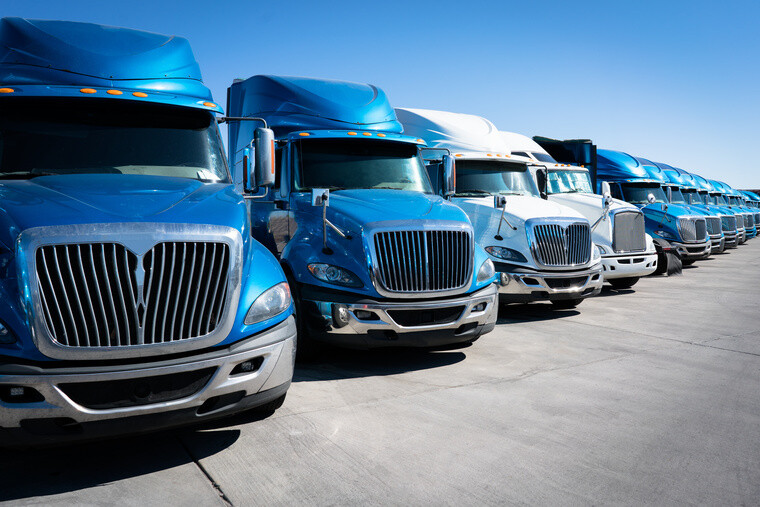 Fleet of semi-truck cabs US semi truck cabs lined up in a row