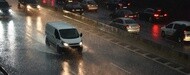 Van rolling on a wet road