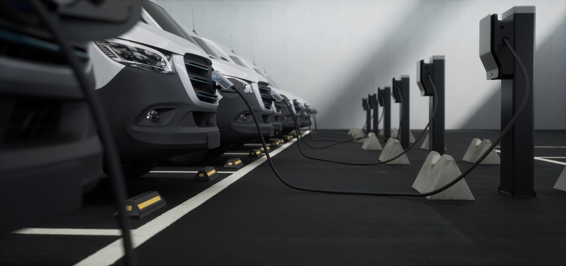 Fleet of electric vans connected to charging stations