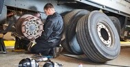 Mechanic working on trailer tires