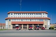 Fire engine behind a fire station: 4x4 fire engine, fire truck,…