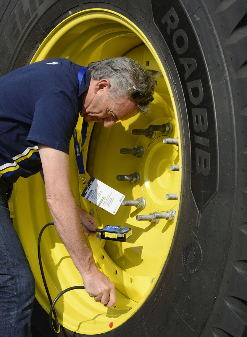 Manually adjust tractor tire pressure