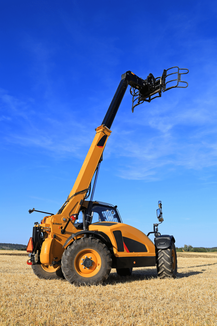 Telehandler working in a field