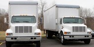 White box trucks parked side by side