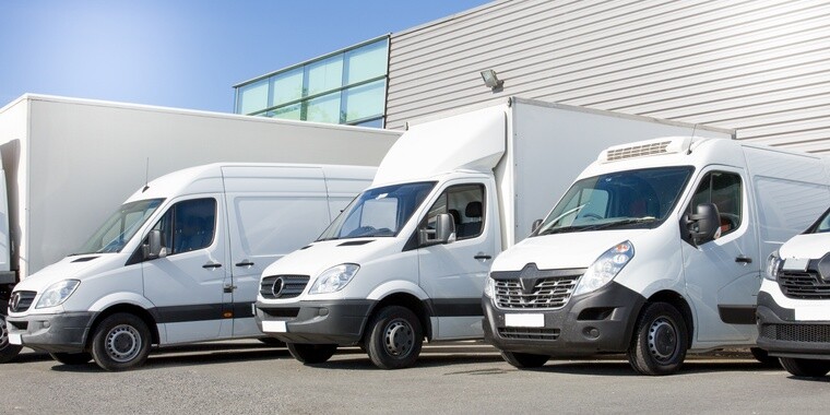 white transport vehicles: box truck, commercial van