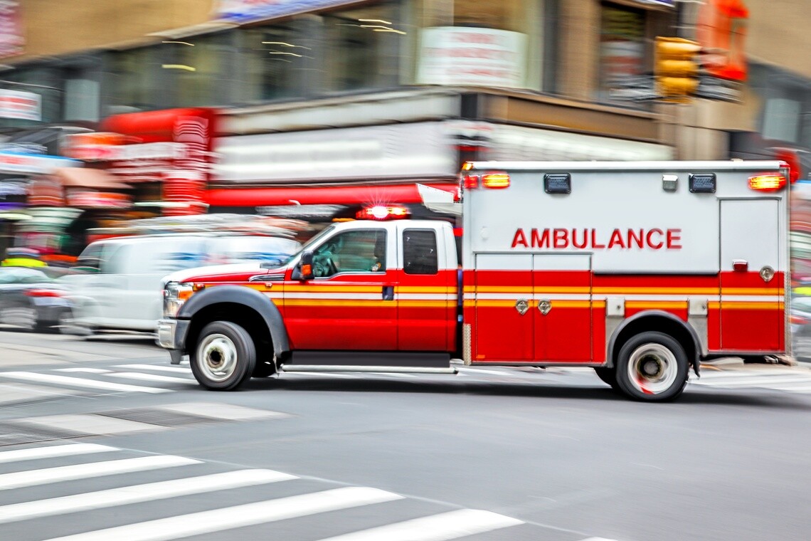 Type 1 ambulance with emergency lights on