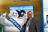 The Michelin man and booth participant at minexpo