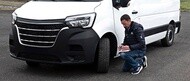 Fleet manager checking commercial van tyres