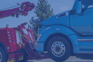 Blue cab of a semi truck hooked to a tow truck and photo has blue overlay
