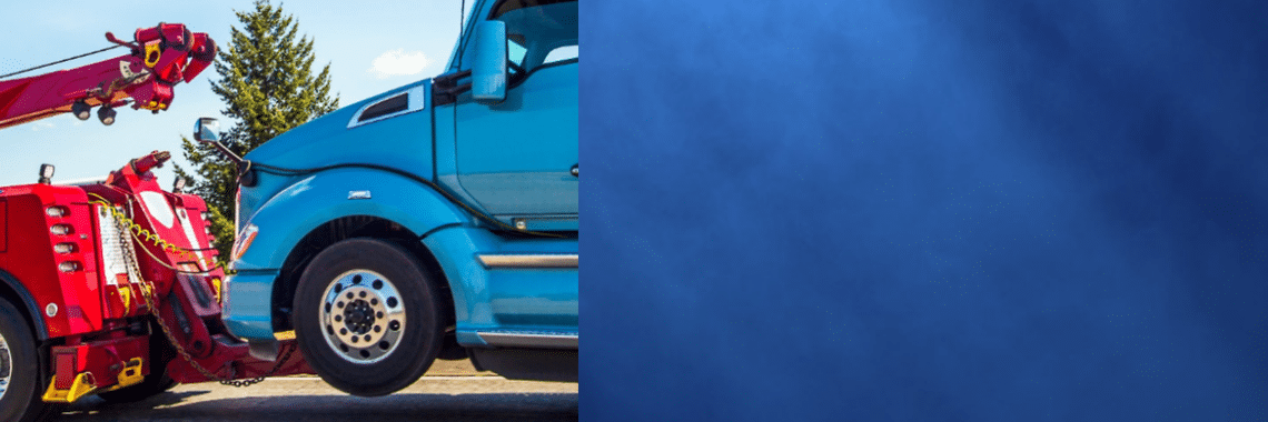 Split image of blue cab semi being towed on the left and right is blue gradient background