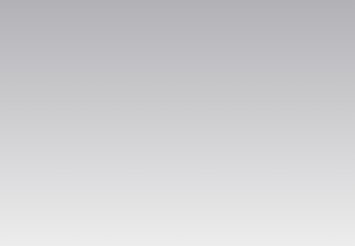 A gray background in a gradient pattern showing dark gray in the top right corner fading into a light gray at the bottom left corner