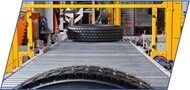 Commercial truck tires moving through the Michelin retread manufacturing process