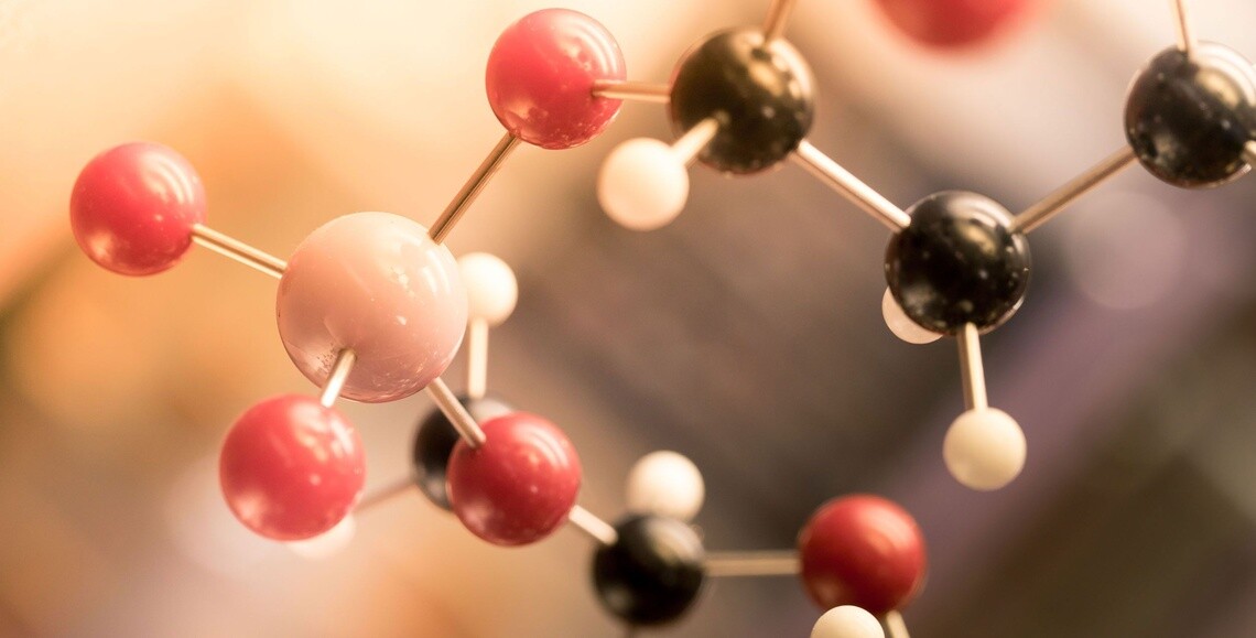 A close-up of a molecular model representing atoms and bonds.