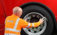 Man checking tyre pressure