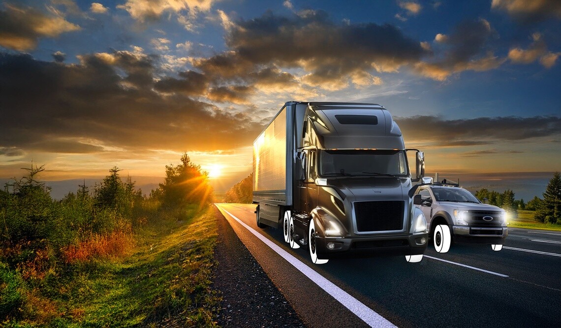Semi truck and Light duty truck on highway with white overlay tires