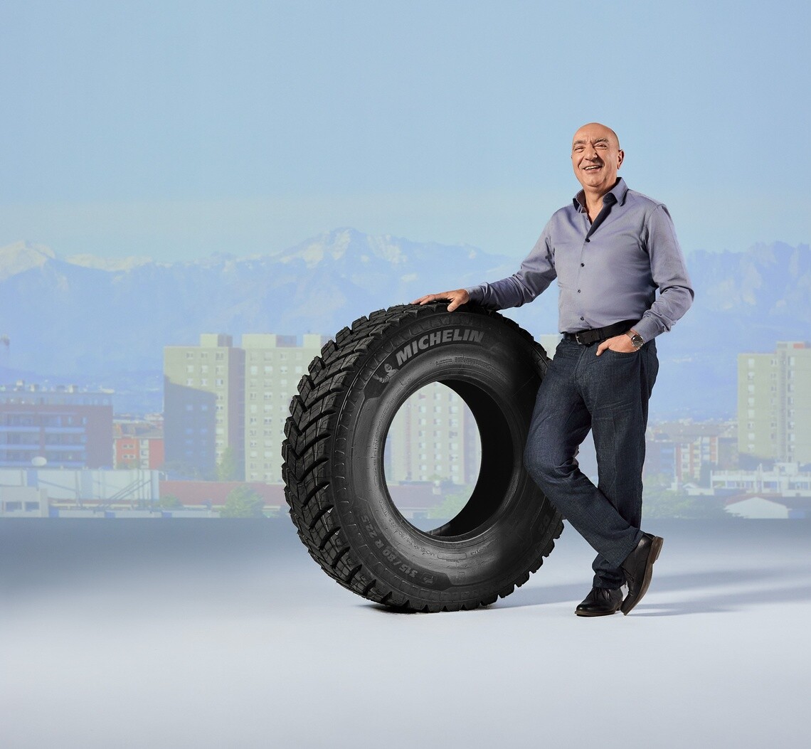 Eduardo Andreu, owner of a transport business, and Michelin customer, stands with a Michelin X Works tire