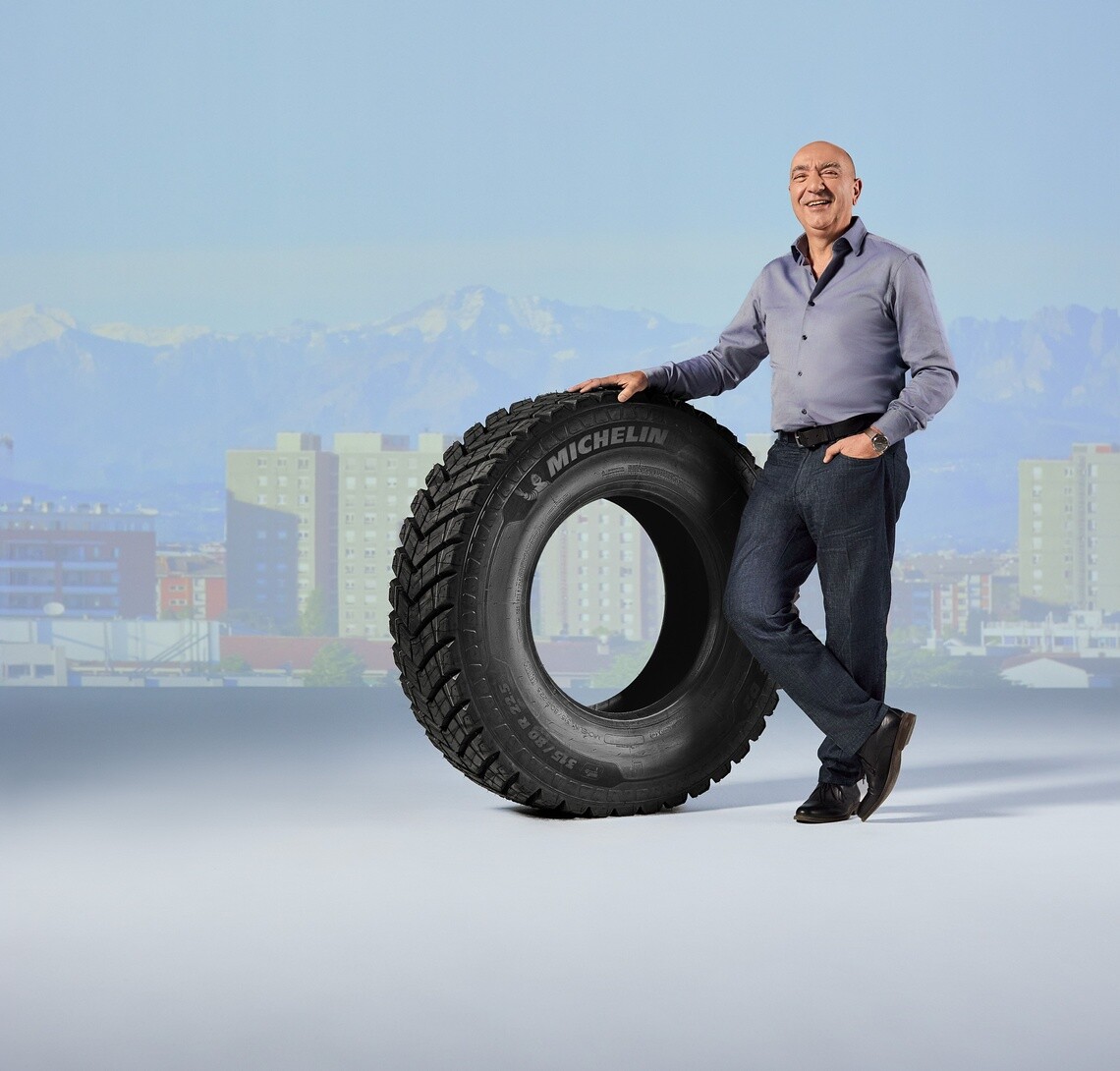 Eduardo Andreu, owner of a transport business, and Michelin customer, stands with a Michelin X Works tire
