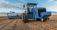 Tractor with tracks on a field