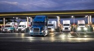 Commercial trucks at a fuel station, illustrating fuel consumption management and fuel-efficient fleet operations.
