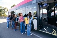Passengers boarding a bus for public transportation