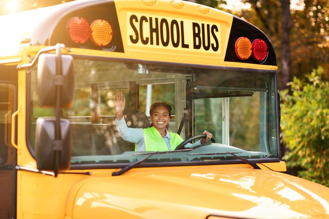 School bus driver behind the wheel of a school bus