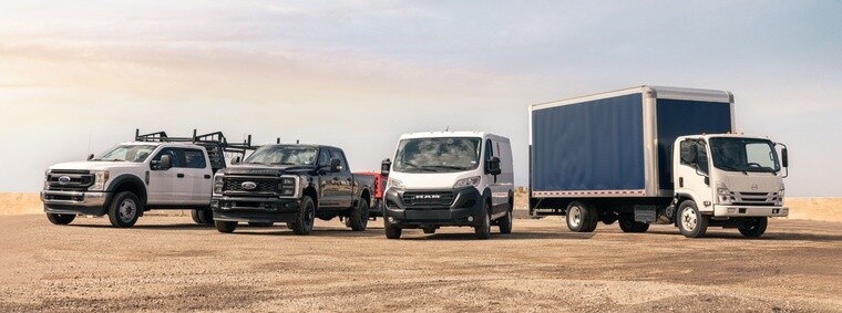 Commercial work trucks, pickup truck, cargo van and box truck representing professional fleet vehicles