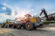 Two wheel loaders at an industrial construction worksite