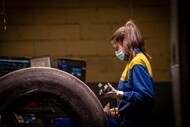 worker at a retreading machine
