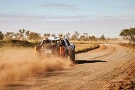 racing pickup back dust
