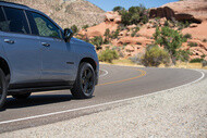 SUV with Michelin Defender LTX M/S2 tires driving with rocky mountains on the background