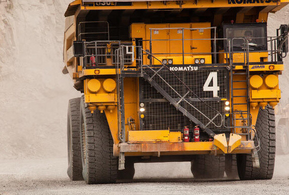 Rigid Dump Truck in action, focus on used tyres
