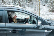 guide woman drive in snow