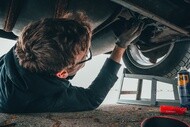 man fixing vehicle engine 2244746